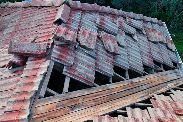 A photo of a roof of a property damaged and requiring maintanance