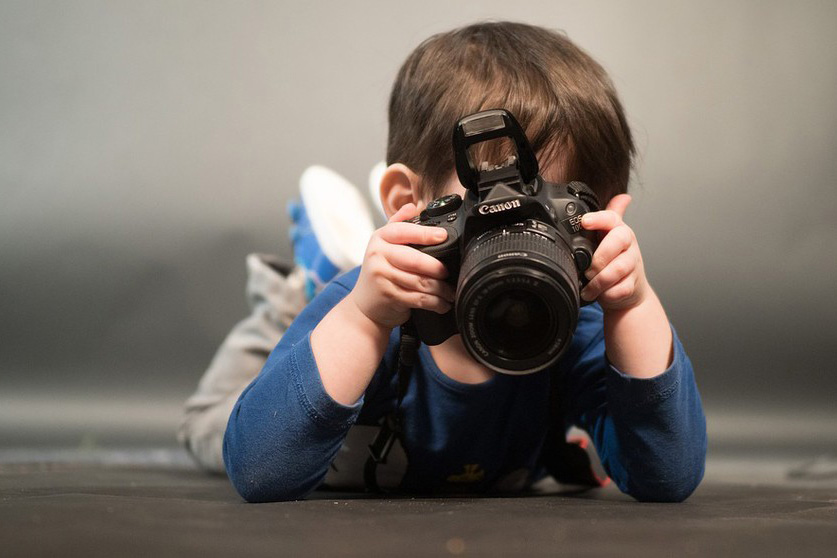 Photo of a child photographing